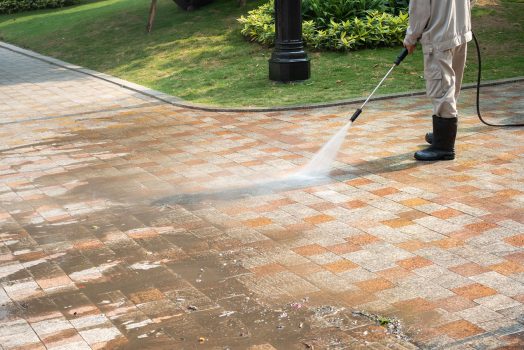 Outdoor floor cleaning with a pressure water jet on street Outdoor floor cleaning with a pressure water jet on street